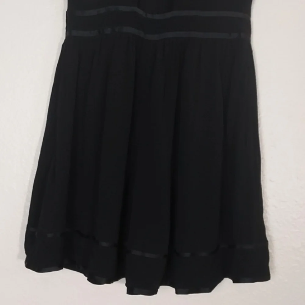 Anthropologie Romper Ruffled Black Size 6